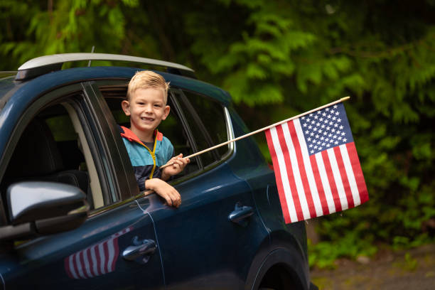 istock Child holding American USA flag 2149734786