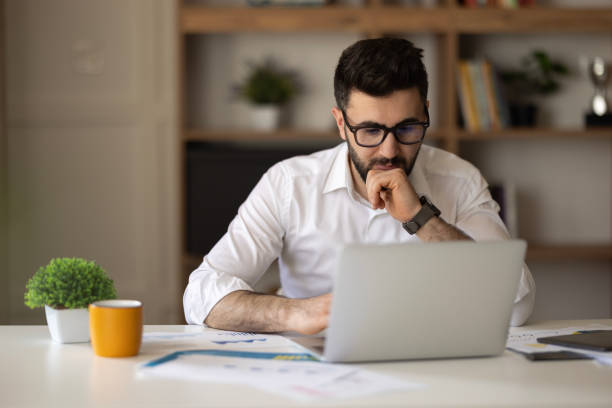 istock Young man freelancing from his home office 2149734826