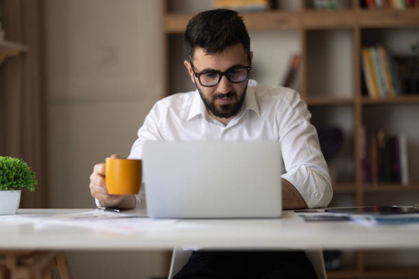 istock Young man freelancing from his home office 2149735062