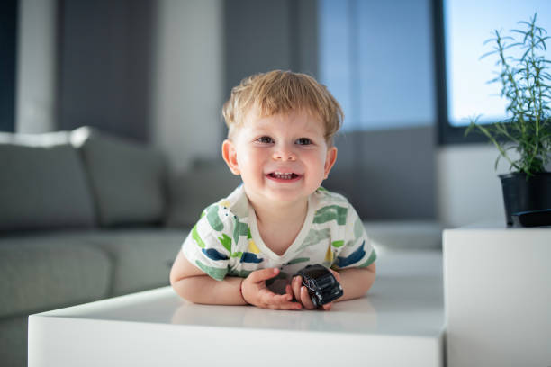 Portrait of a cute blonde boy smiling.