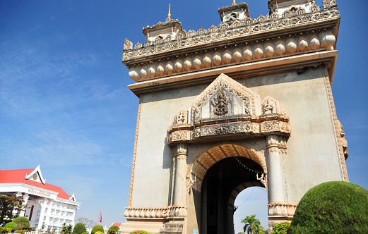 Vientiane, Laos:  Patuxai (literally Victory Gate or Gate of Triumph) - Patuxai was built in the 1960s as a “Monument to the Heroes of the Royal Army”, celebrating Laos' independence from France (1949). It was popularly known simply as Anousavali (monument) or in French as the 'Monument Aux Morts'. In 1995, on the 20th anniversary of the seizure of power by the communists of Pathet Lao, the triumphal arch was given the new dedication to “The Heroes of August 23, 1975” (Day of the Communist seizure of power in Vientiane).