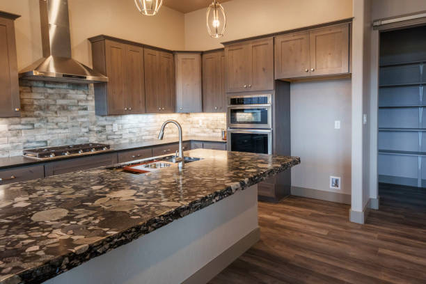 istock Wide Angle View of a Modern Executive Home Interior with Open Concept, Hardwood Floors, Designer Lighting and Granite Kitchen Counter Top 2149740903