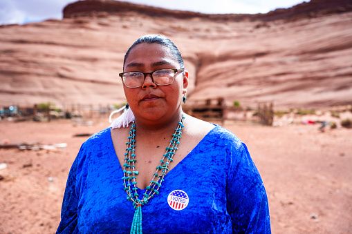 Young Navajo Woman in Monument Valley Tribal Park Arizona Holding an I Voted Sticker Doing Her Civic Duty
