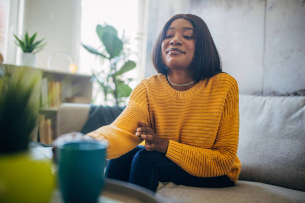 istock Content woman holding cup on cozy couch 2149742400