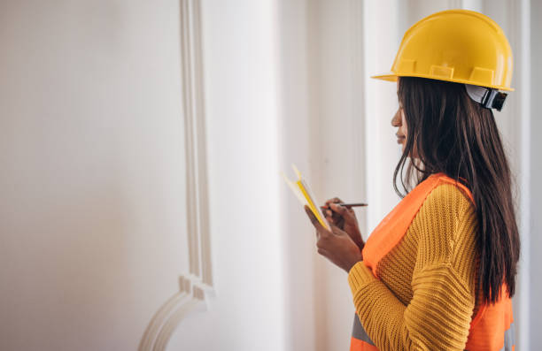 istock Safety inspector reviewing wall details 2149742492