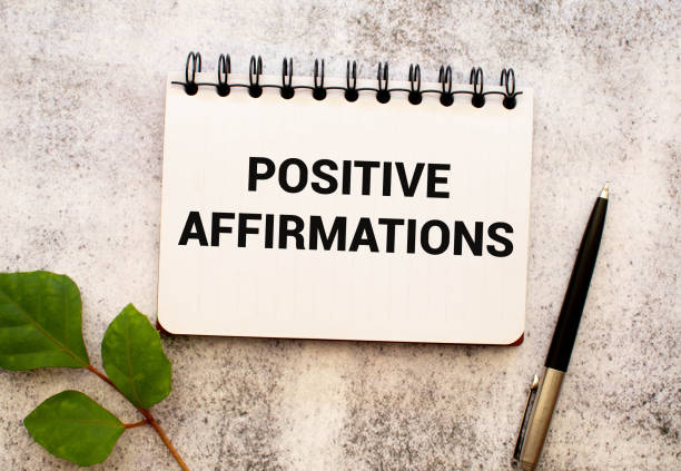 istock The text POSITIVE AFFIRMATIONS appearing behind torn paper. 2149742507