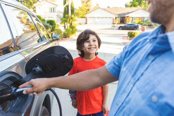 istock Family with electric vehicle 2149743439