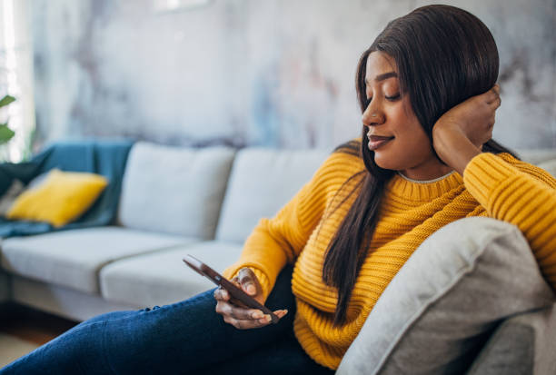 istock Woman holding phone with head resting on hand 2149744020