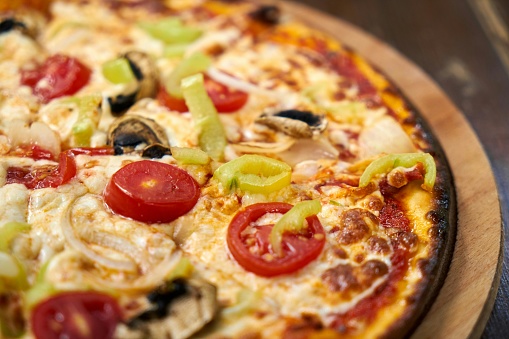 Pizza (Italian: pizza) is a savory dish from Italy, a type of round and flat dough, which is baked in the oven and usually covered in tomato sauce and cheese with other additional food ingredients that can be chosen according to taste. The cheese used is usually mozzarella or pizza cheese, it can also be parmesan and several other types of cheese.