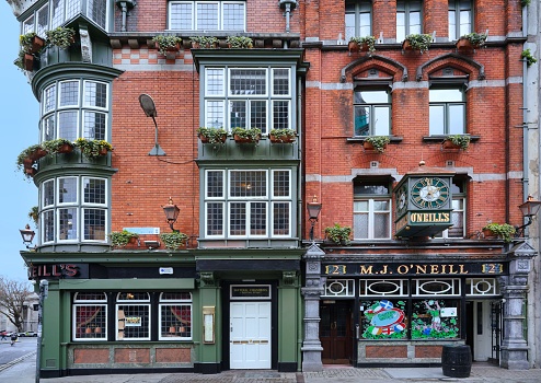 Dublin, Ireland - March 2023:  Traditional Irish pub building with leaded glass windows