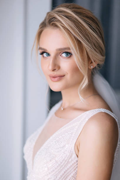 istock a bride with beautiful makeup with blue eyes and a sweep to smil 2149747113