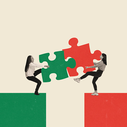 Two young women, employees pulling puzzle peace symbolizing professional competition. Conceptual creative design. Concept of business, achievement, challenges, promotion, cooperation