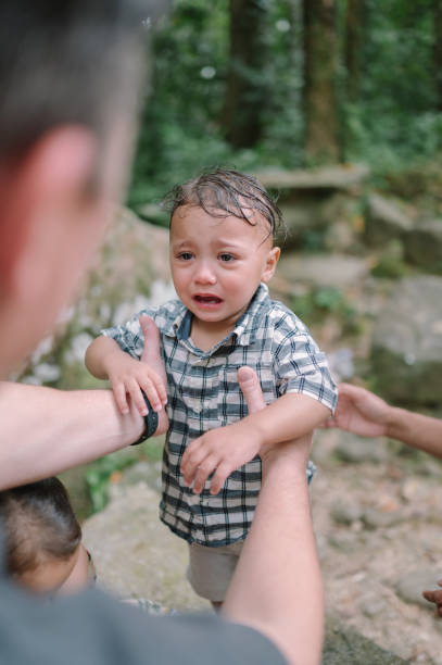 istock Latin american young boy makes his way through an overgrown forest 2149755851