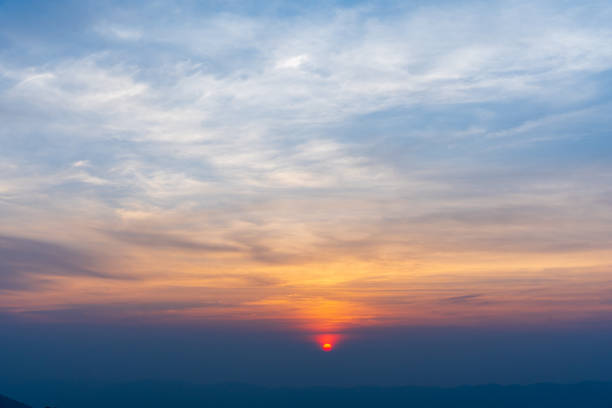 istock Dramatic cloudy sky and bright sunrise or sunset over the horizon. Natural skyscape background 2149755888