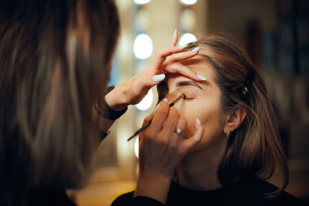Professional Make-up Artist Applying Eyeshadow with a Brush