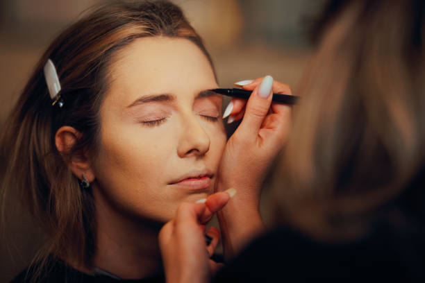 istock Makeup Artist Filling in Brows with a Pen Creating a Look 2149756498