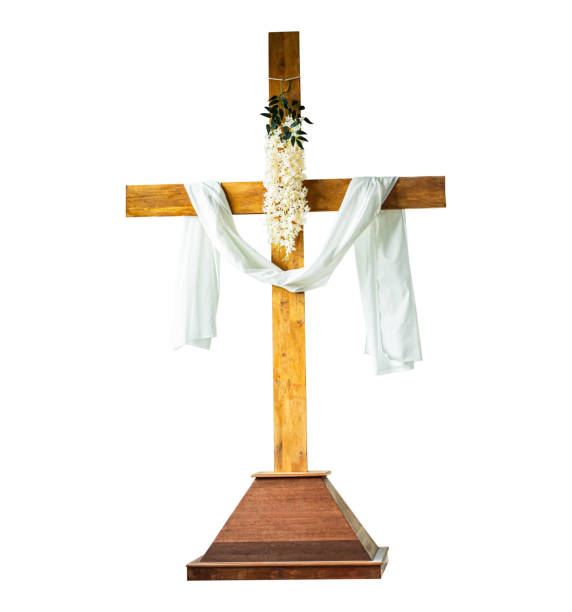 wooden crucifix wrapped in fabric isolated on white background.