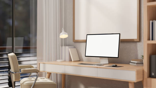 istock A contemporary minimalist home office features a white-screen computer mockup on a wooden desk. 2149758883