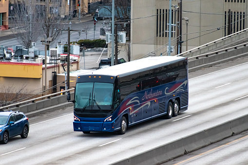 March 2022 - Spokane, Washington USA.
A Northwestern Stage Lines motorcoach charter bus on Interstate 90 in downtown Spokane, WA.
Northwestern provides both charter bus services, as well as regular intercity routes.