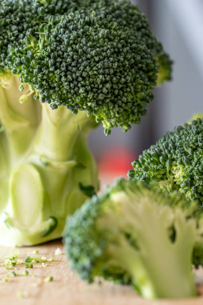 istock Close up of green broccoli on the cutting board on the table 2149759421