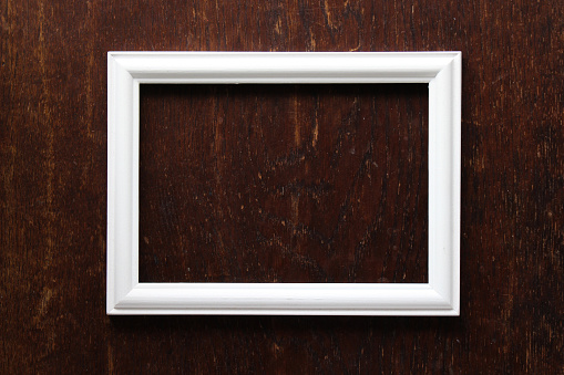 white picture frame and woody background