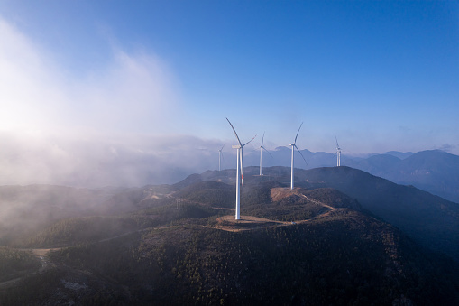 Wind turbines on the mountaintop in backlight