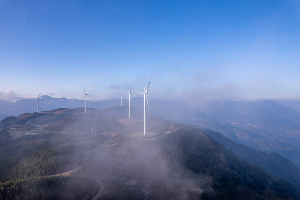 The wind turbine on the mountaintop in the mist