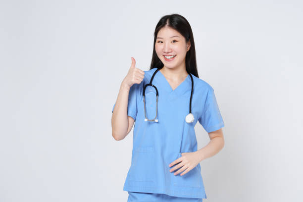 istock Smiling young woman doctor with stethoscope showing thumbs up isolate on white background. 2149763971