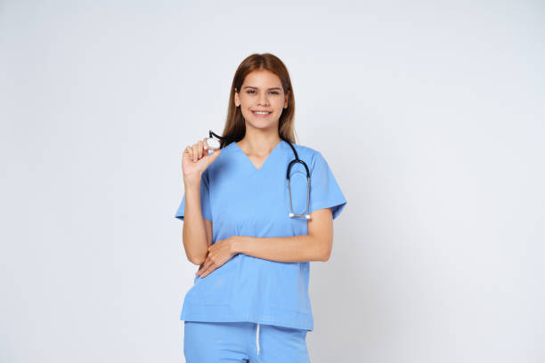 Young doctor woman wearing a stethoscope isolated on white background.