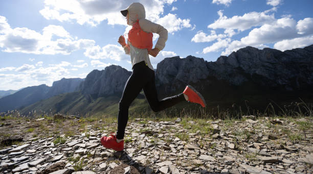 istock Young woman ultramarathon runner running at mountain top 2149764689