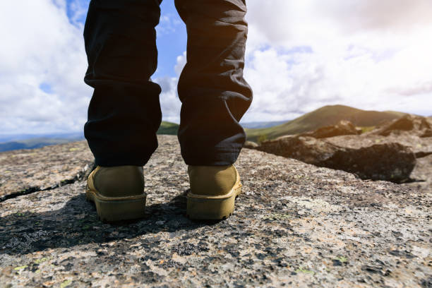 Successful hiker taking photo on mountain top
