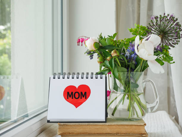 istock Notepad with the word MOM. Greeting card 2149767693