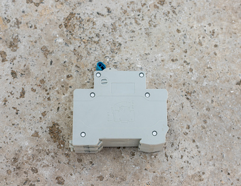 Circuit breaker on concrete floor side view