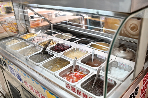 Taiwan - 04.04.24: An ice chest at a shaved ice stand. Shaved ice with toppings like red beans, mung beans, pinto beans, grass jelly, aiyu, konjac, white fungus, almond jelly, and taro is popular.