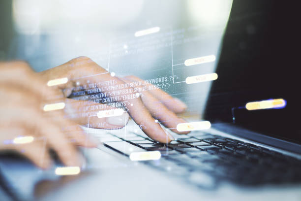 istock Double exposure of abstract programming language hologram with hands typing on laptop on background, research and development concept 2149768381