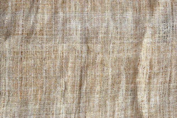 brown sackcloth texture background, crumpled burlap fabric textile for design