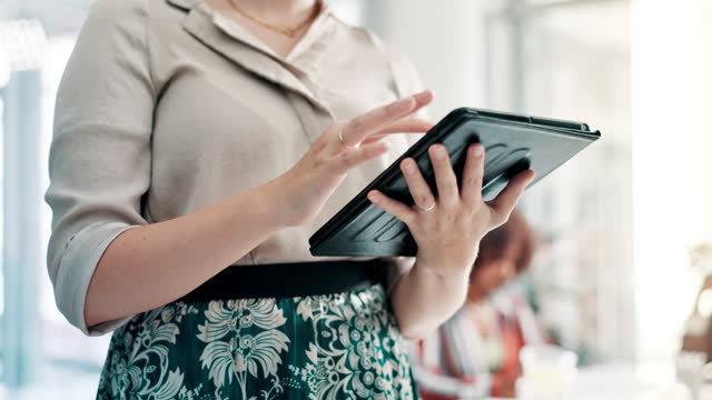 Business woman, hands and browsing with tablet at office for communication, research or networking. Closeup of female person or employee scrolling on technology for online search at the workplace