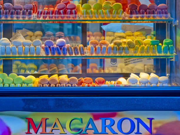 The City of Paris France on October 19, 2023:   Street vendor with a colorful display of classic macaron cookies in the Paris France Latin Quarter