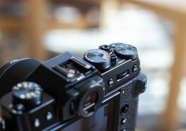 istock The black retro designed camera is mounted on a tripod for making photo or video footage. Wheels on the camera for setting up. 2149770580