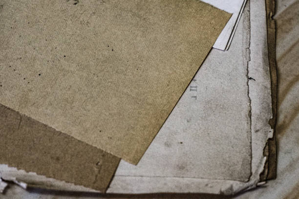 Piles of rusty old papers, piles of old documents over time.
