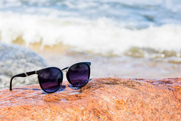 sunglasses by the sea, vacation and rest time