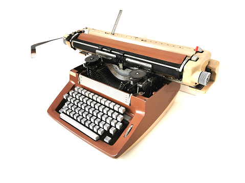 old typing machine isolated on the white background
