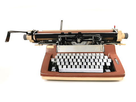 old typing machine isolated on the white background