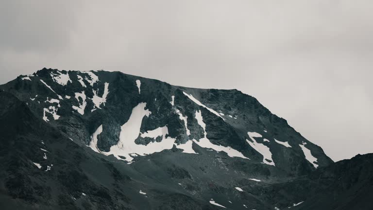 Rocky Mountain With Snow Against Dramatic Sky In Ushuaia, Patagonia, Argentina. wide shot