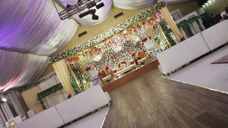 Gorgeous wedding venue adorned with elegant decorations, capturing rotating camera angles.