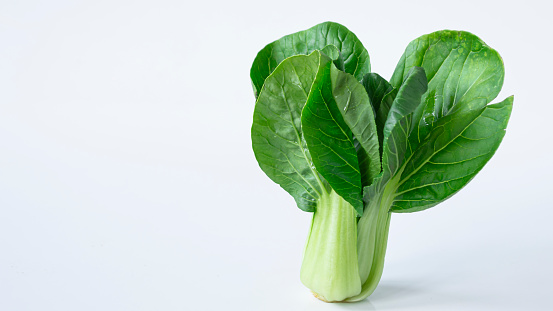 Bright green bok choy isolated on white background. Stir-fried with popular meats