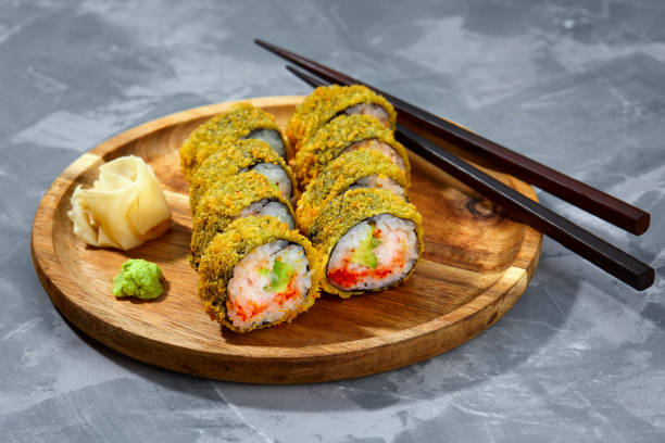 istock Tempura Maki Sushi Deep Fried Sushi Roll Served on wooden board 2149774525