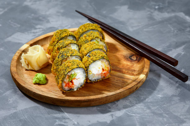 istock Tempura Maki Sushi Deep Fried Sushi Roll Served on wooden board 2149774646