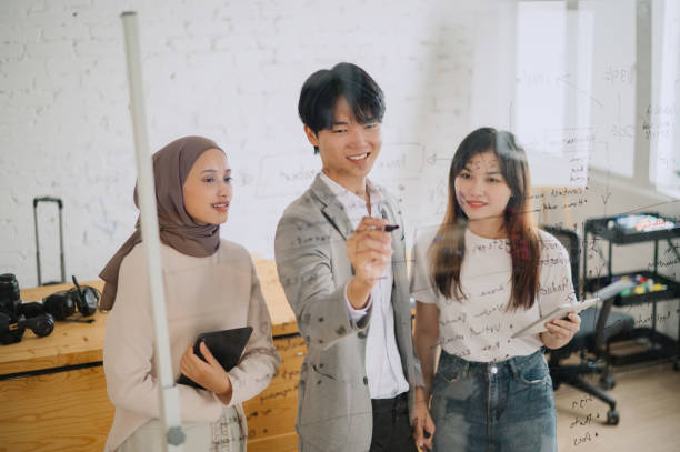 istock Young Asian Businessman presenting his ideas for company development 2149774736