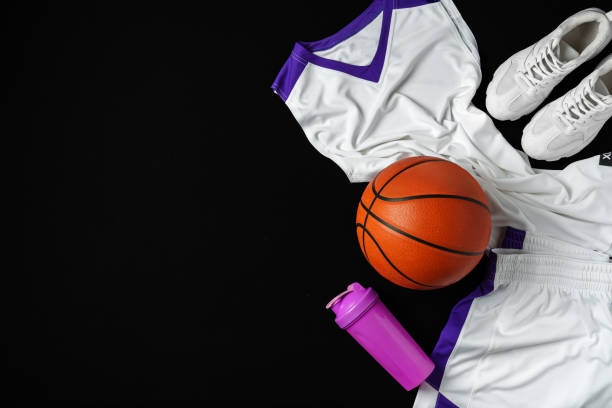 istock Basketball Gear Prepared for an Evening Training Session on a Dark Backdrop 2149775402